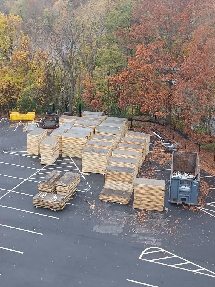 Stacks of rigid roof insulation staged for recycling