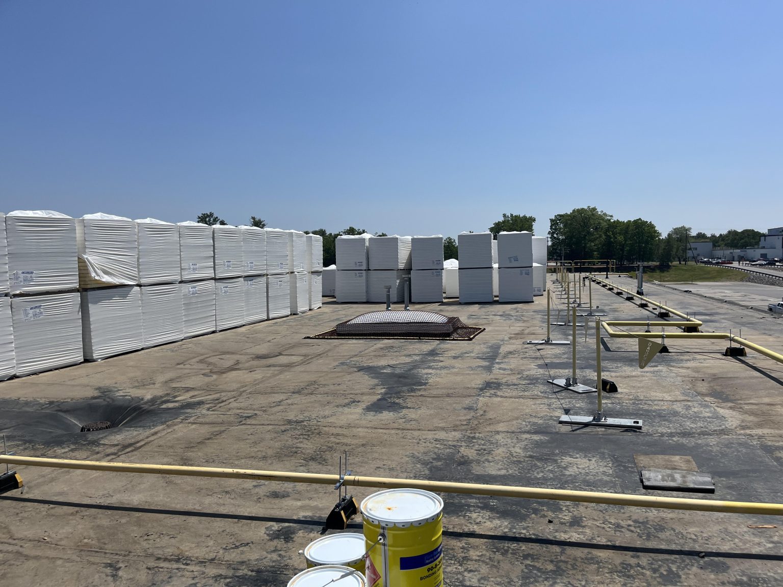 Roof insulation staged on a commercial roof